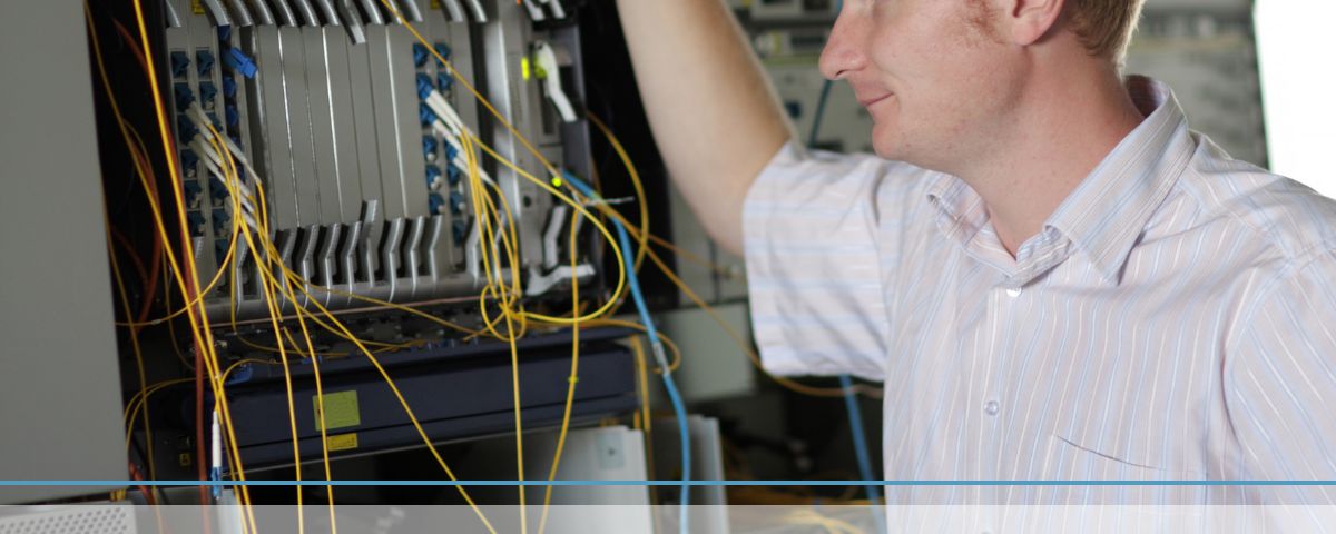man looking at cables